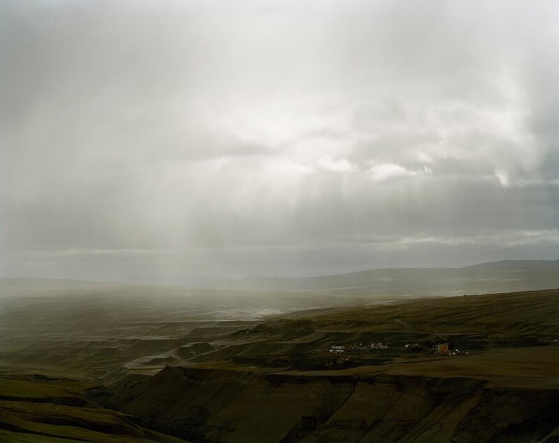 Desolate landscape under stormy sky