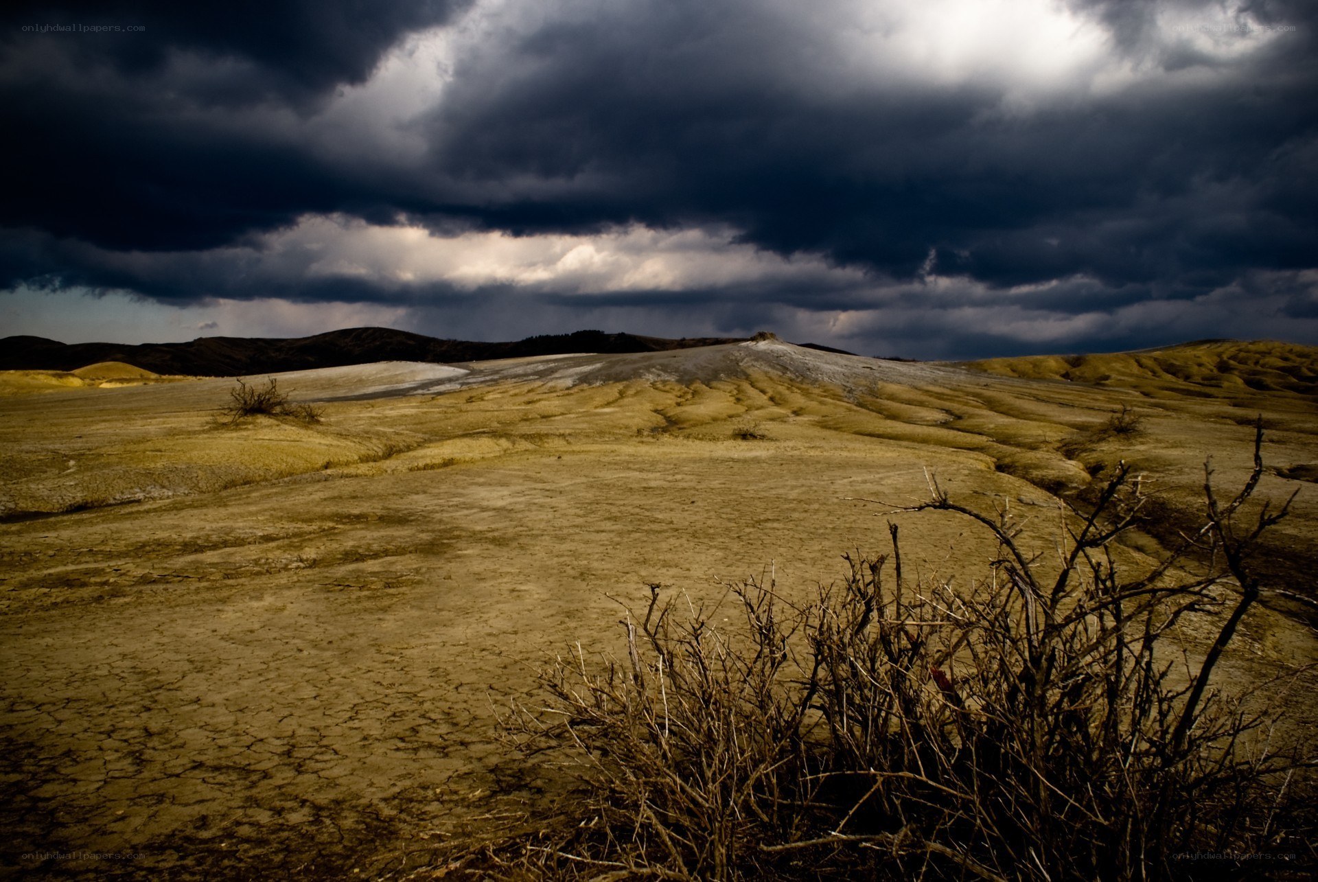 Desolate landscape under stormy sky