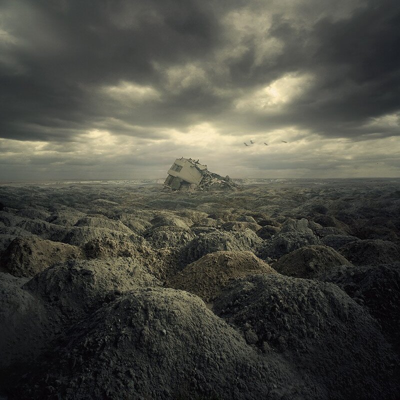 Desolate landscape with wrecked building