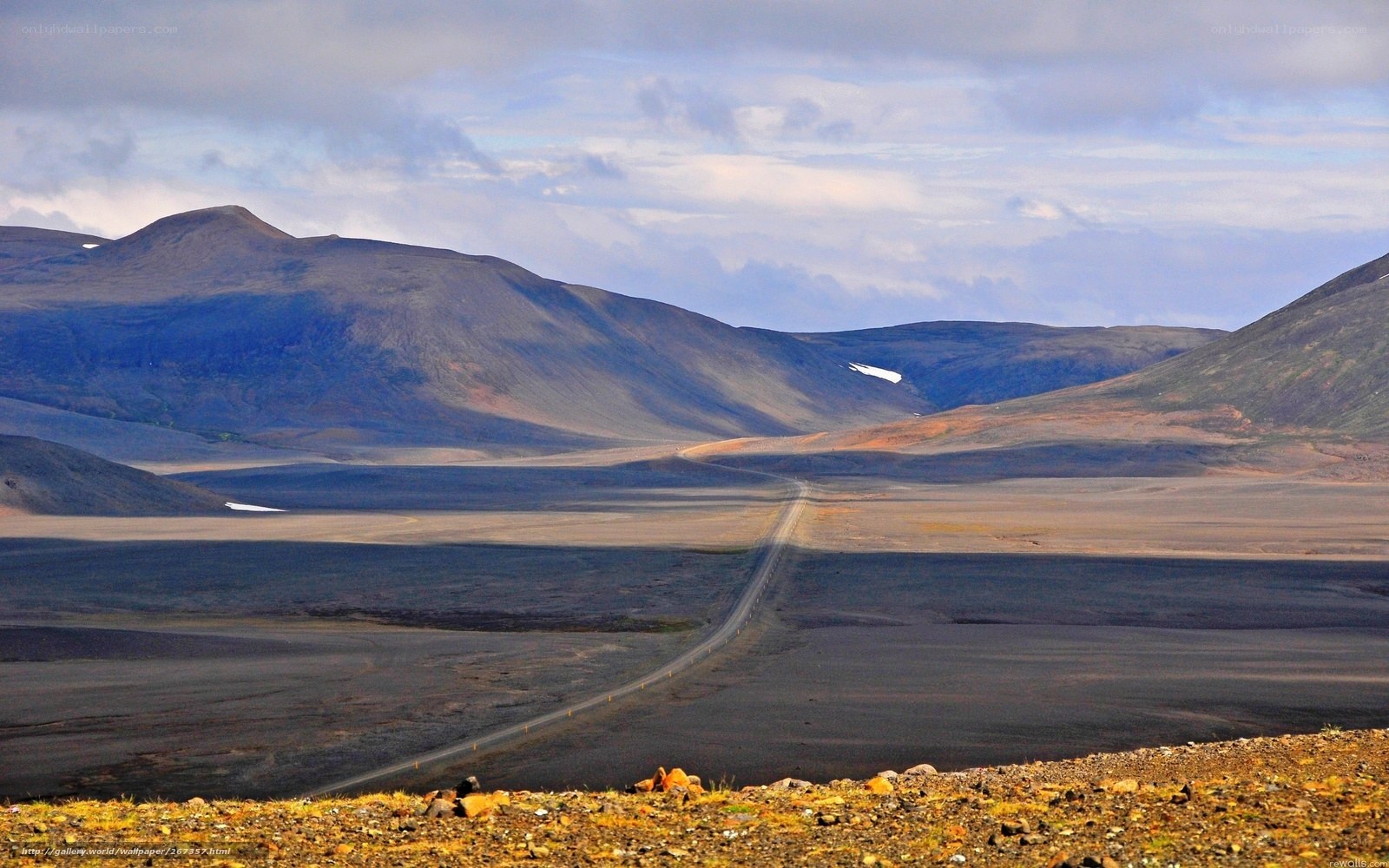 Desolate road through volcanic landscape