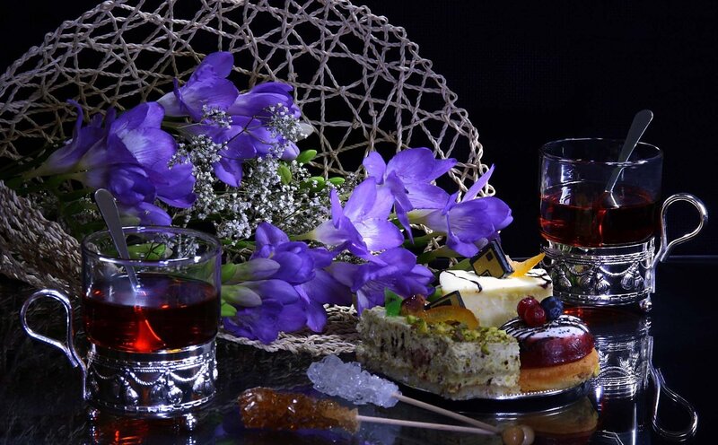 Desserts and Tea on Table — Purple, Dramatic