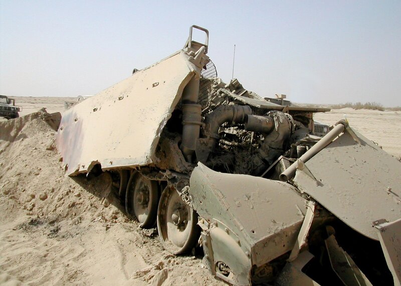 Destroyed military vehicle in desert