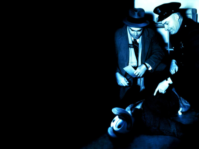 Detective and police officer at crime scene