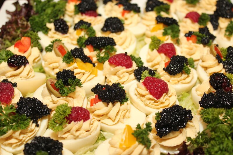 Deviled eggs with caviar and berries