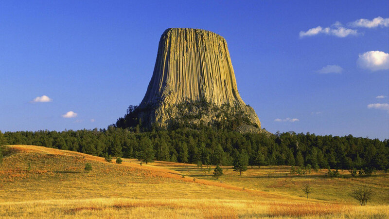 Devils Tower Rock Formation — Blue, Serene, Afternoon, Photograph, Forest, Sky