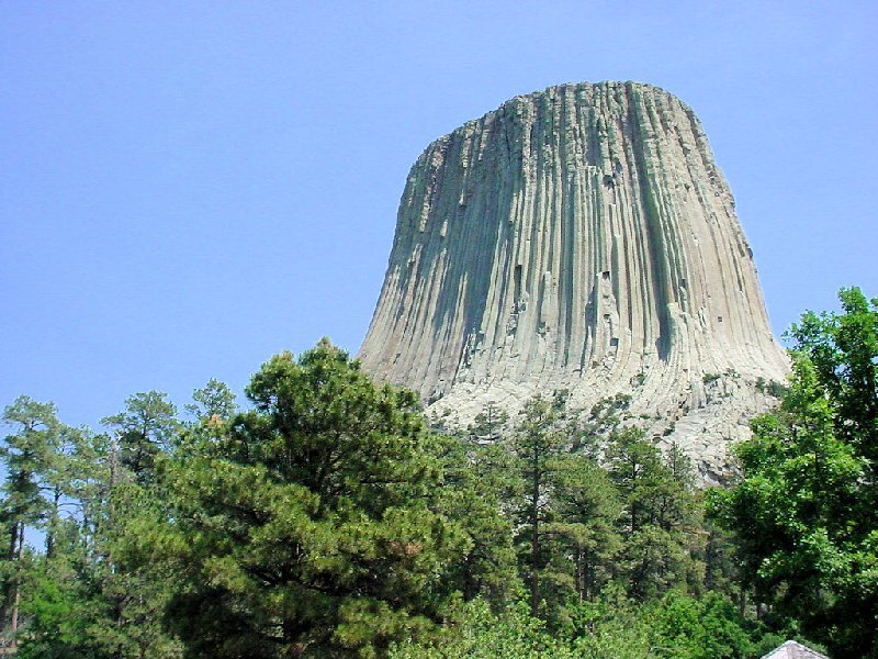 Devils Tower Rock Formation — Blue, Serene, Afternoon, Photograph, Trees, Sky
