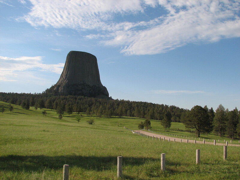 Devils Tower Rock Formation — Green, Serene, Afternoon, Photograph, Grass Field