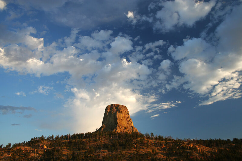 Devils Tower under cloudy sky