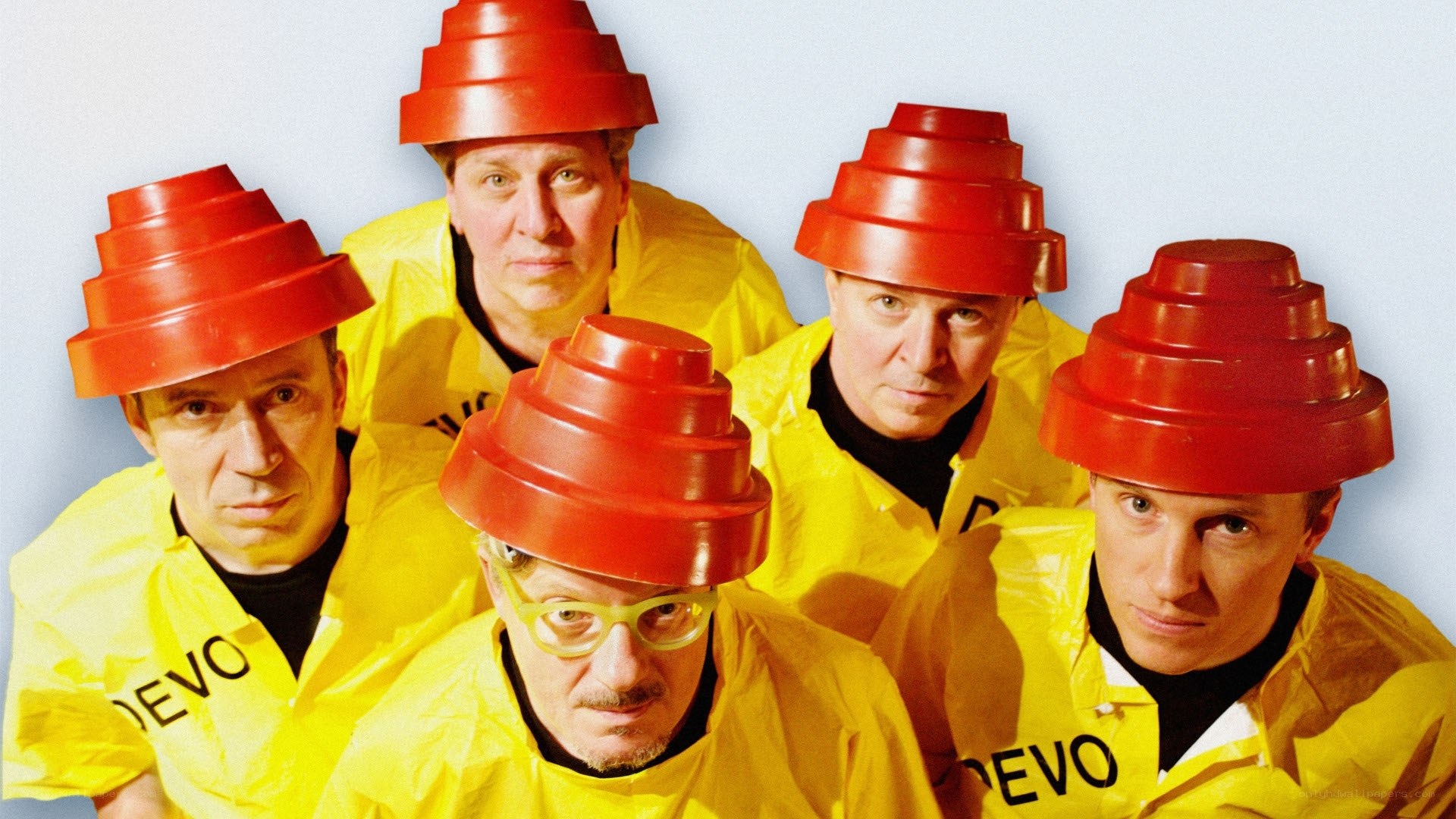 Devo band members in yellow suits