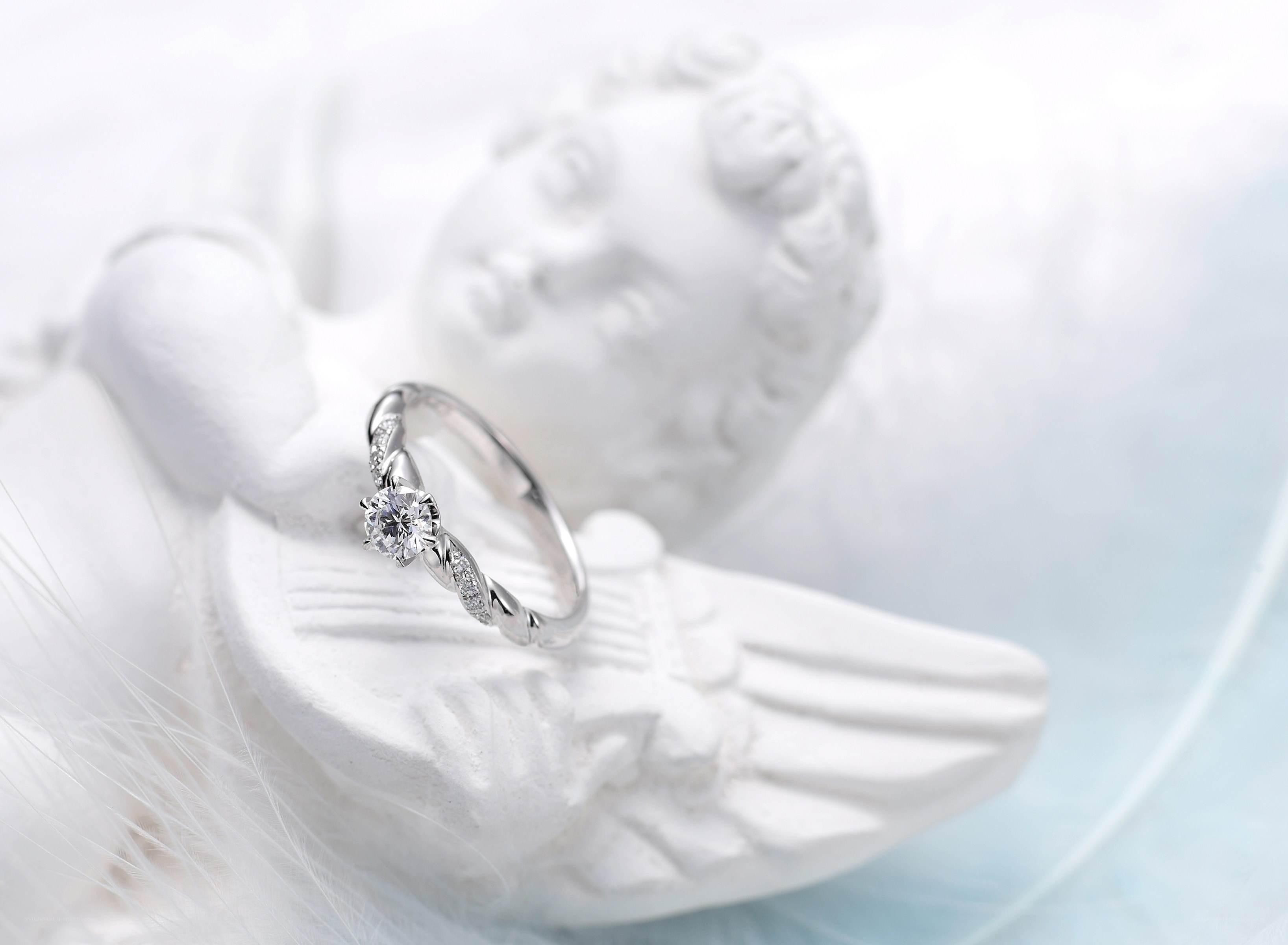diamond ring on angel statue