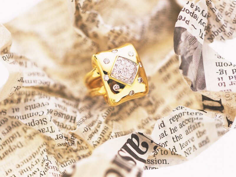 Diamond ring on newspaper