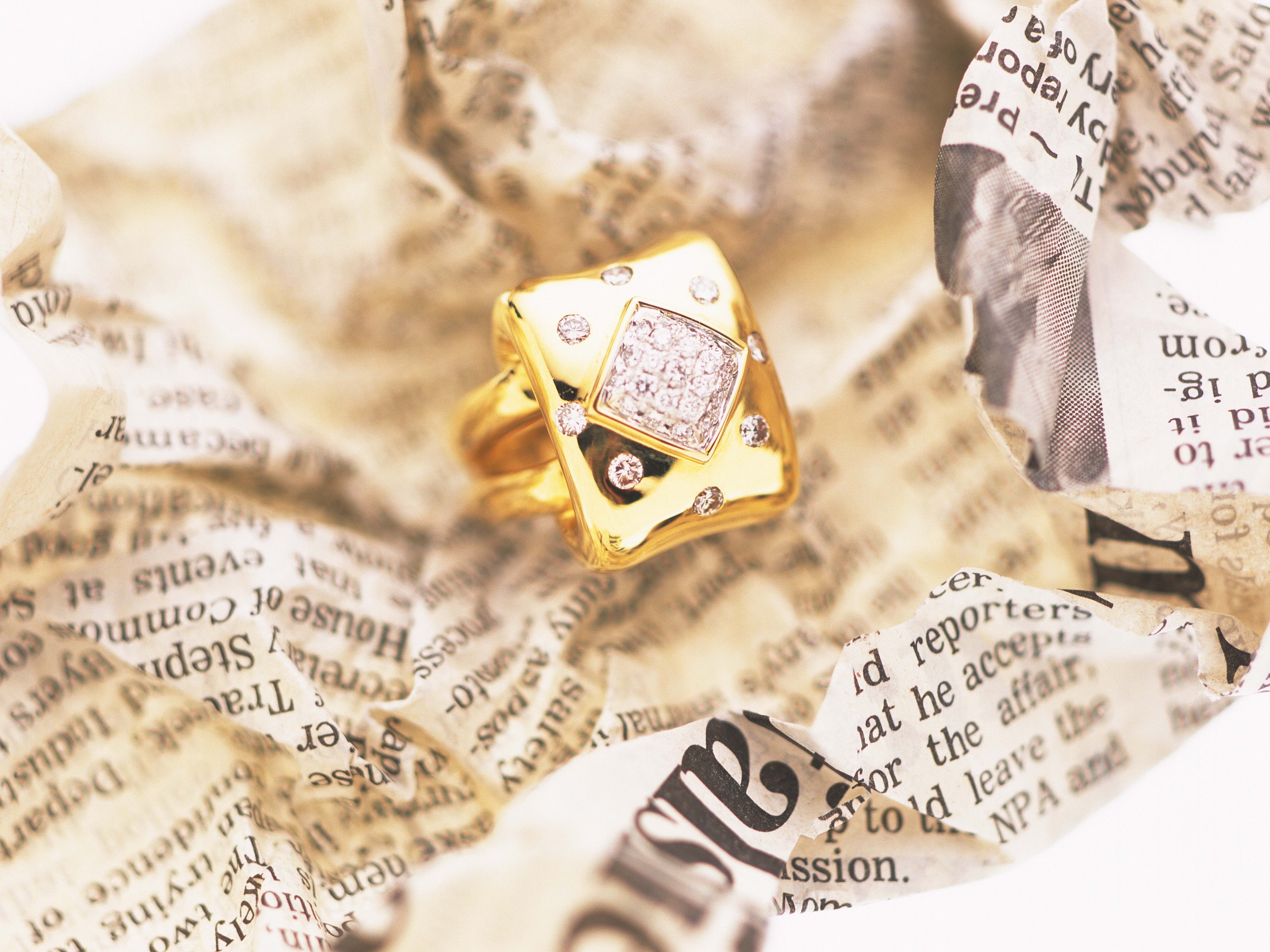 Diamond ring on newspaper