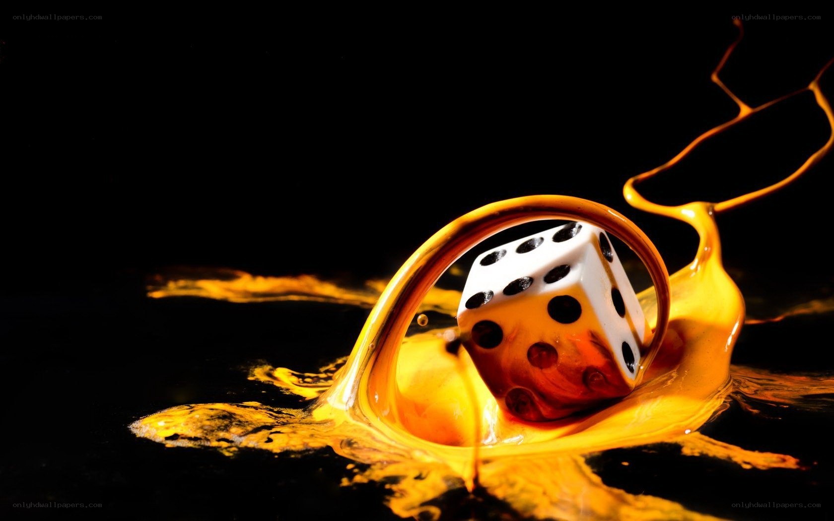 dice in golden liquid splash