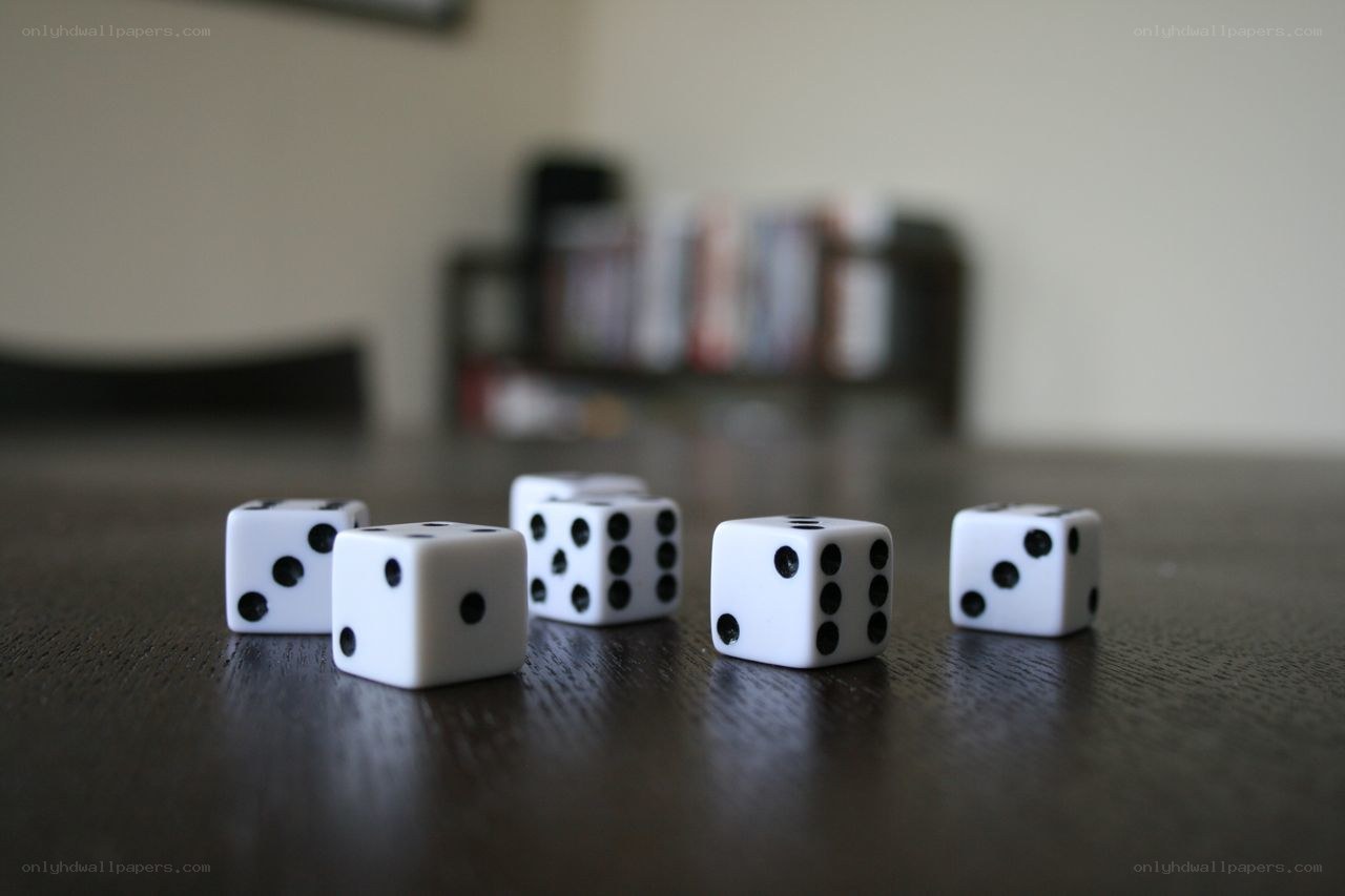 dice on a wooden table