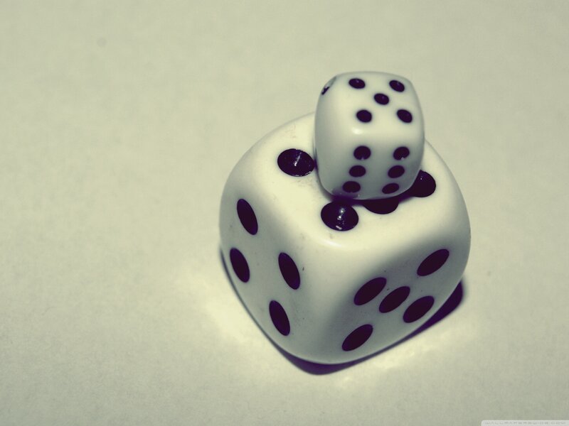 Dice stacked on white surface