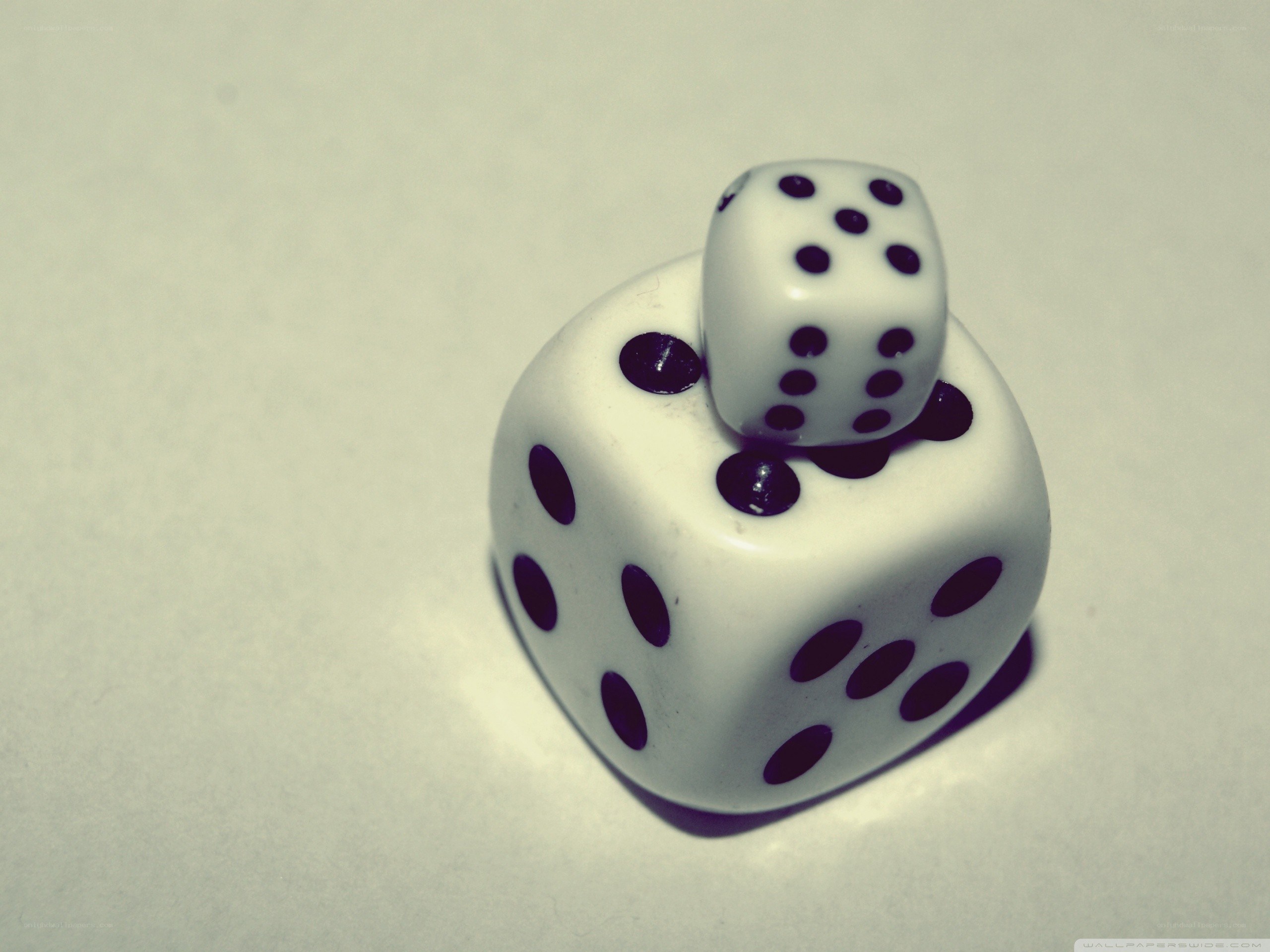 Dice stacked on white surface