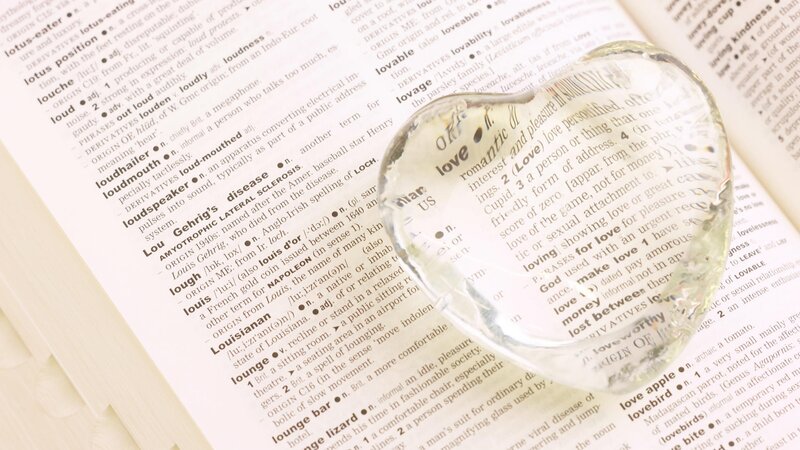 dictionary with heart-shaped glass
