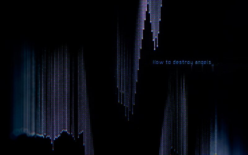 digital text on dark screen