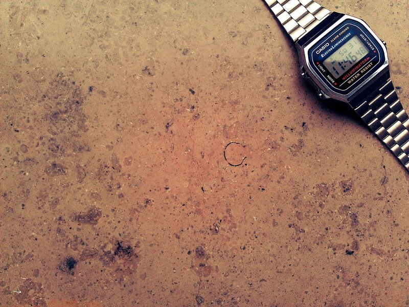digital watch on textured surface