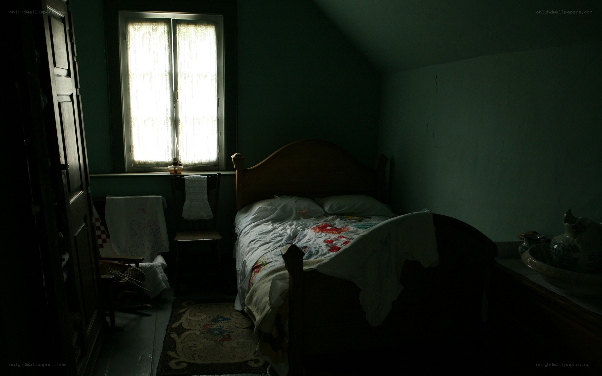 dimly lit bedroom with bed