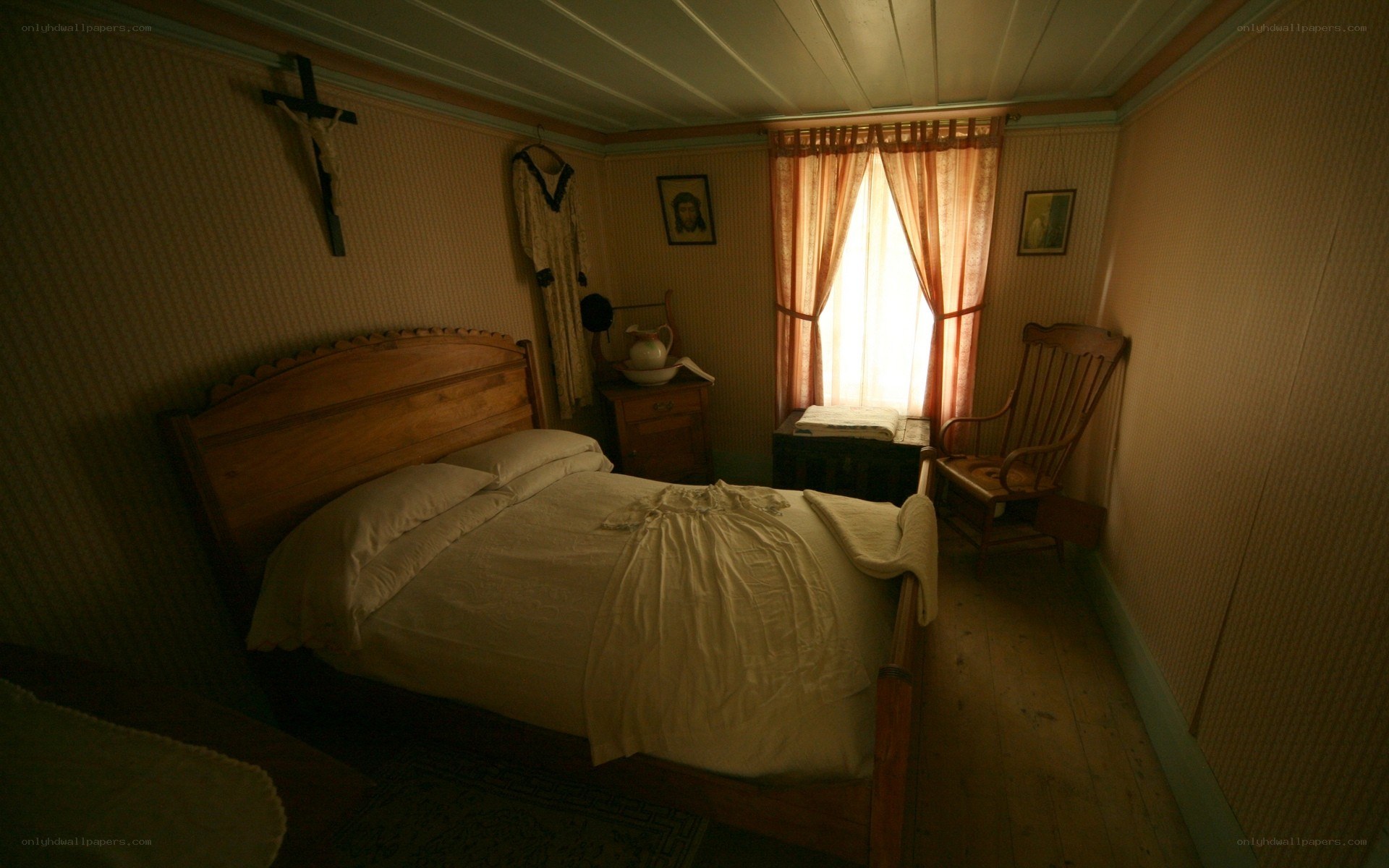 dimly lit bedroom with crucifix