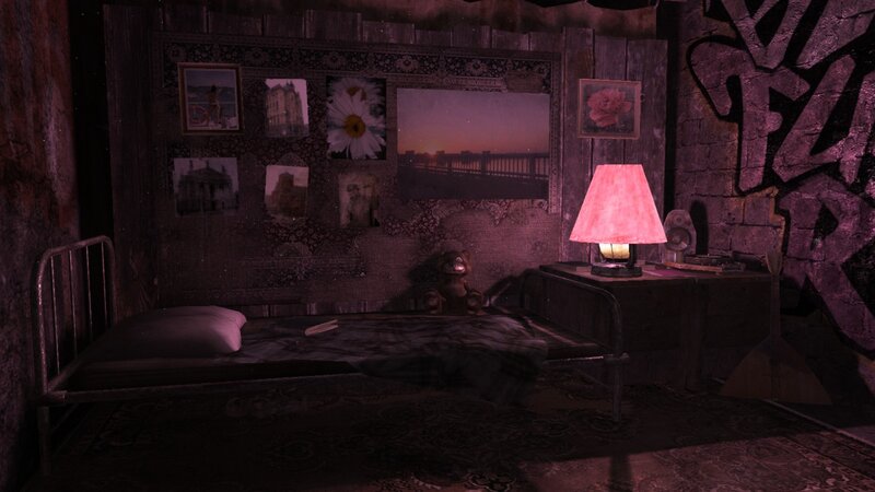 dimly lit bedroom with photos