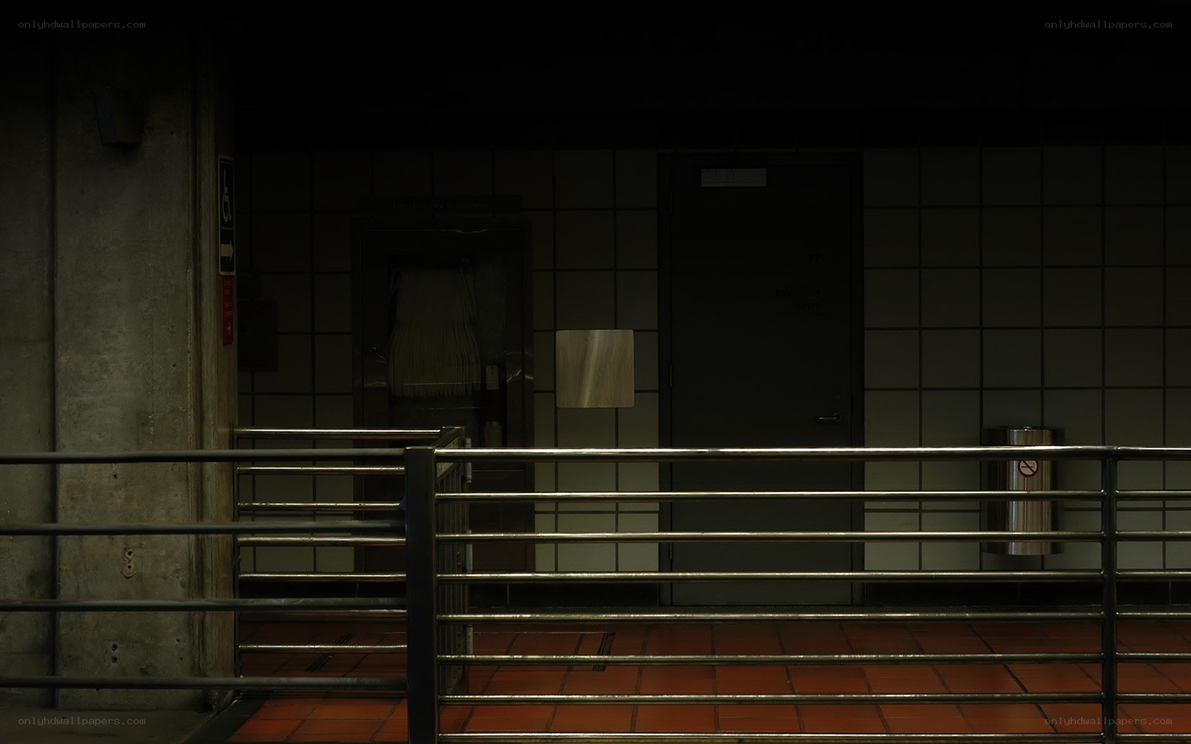 dimly lit hallway with railing