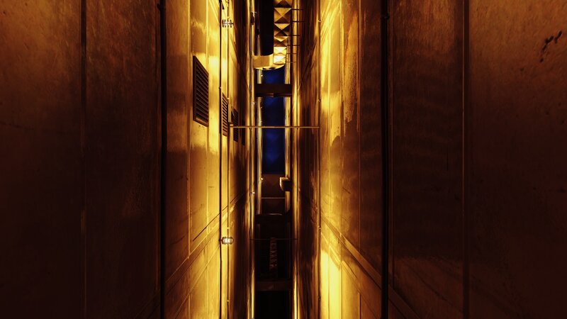 dimly lit industrial corridor