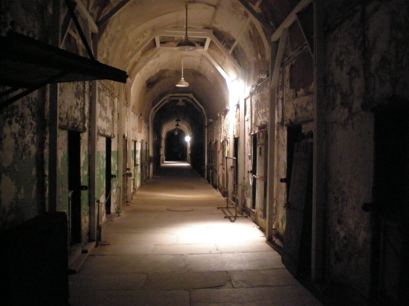 dimly lit prison corridor