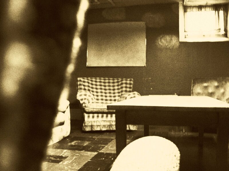 dimly lit room with furniture