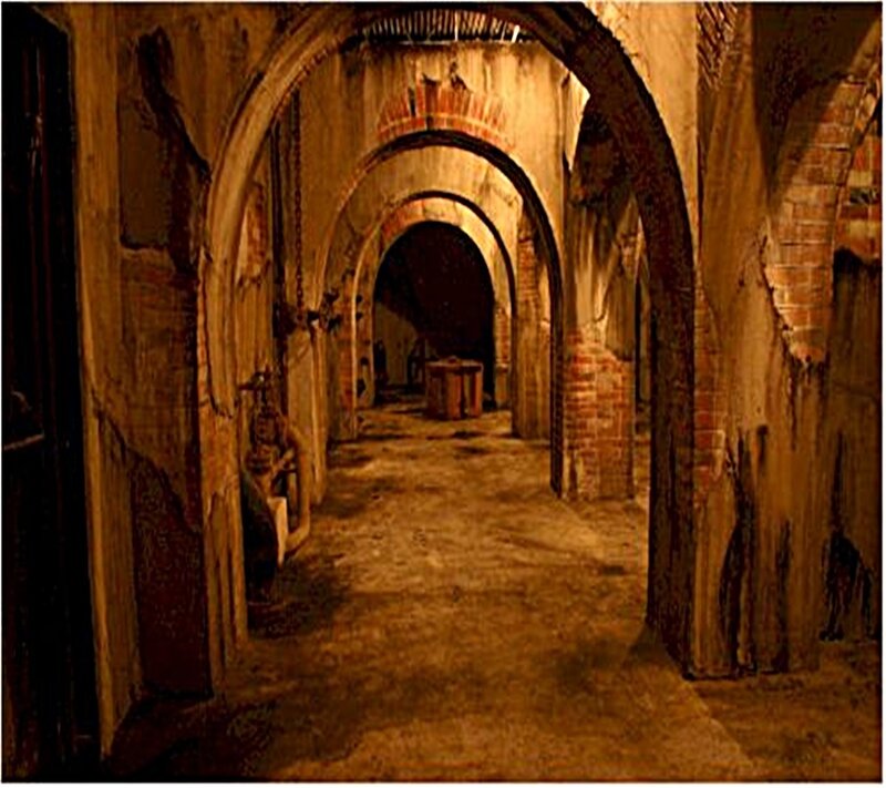 dimly lit stone corridor