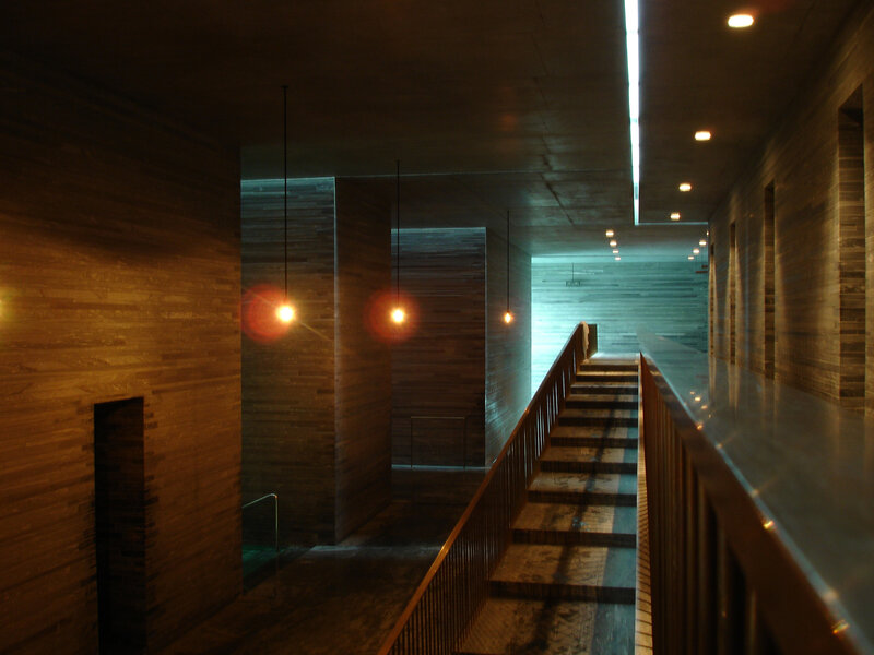 dimly lit wooden staircase