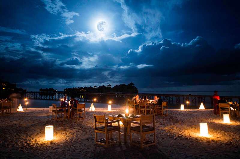 Diners on Beach at Night