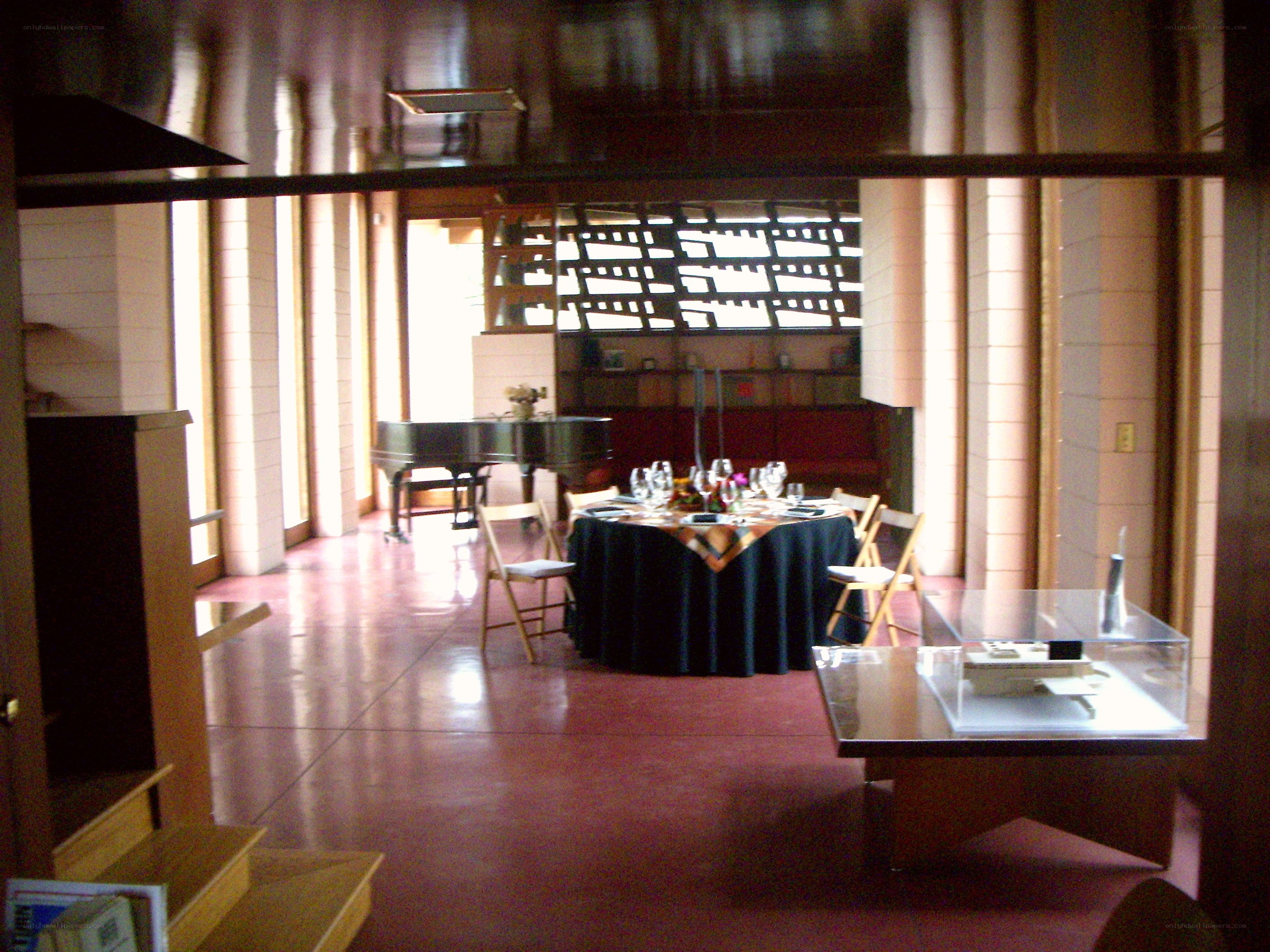 Dining room with piano and display