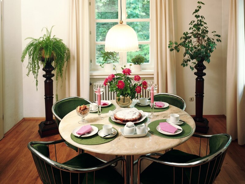 Dining table with cake and flowers