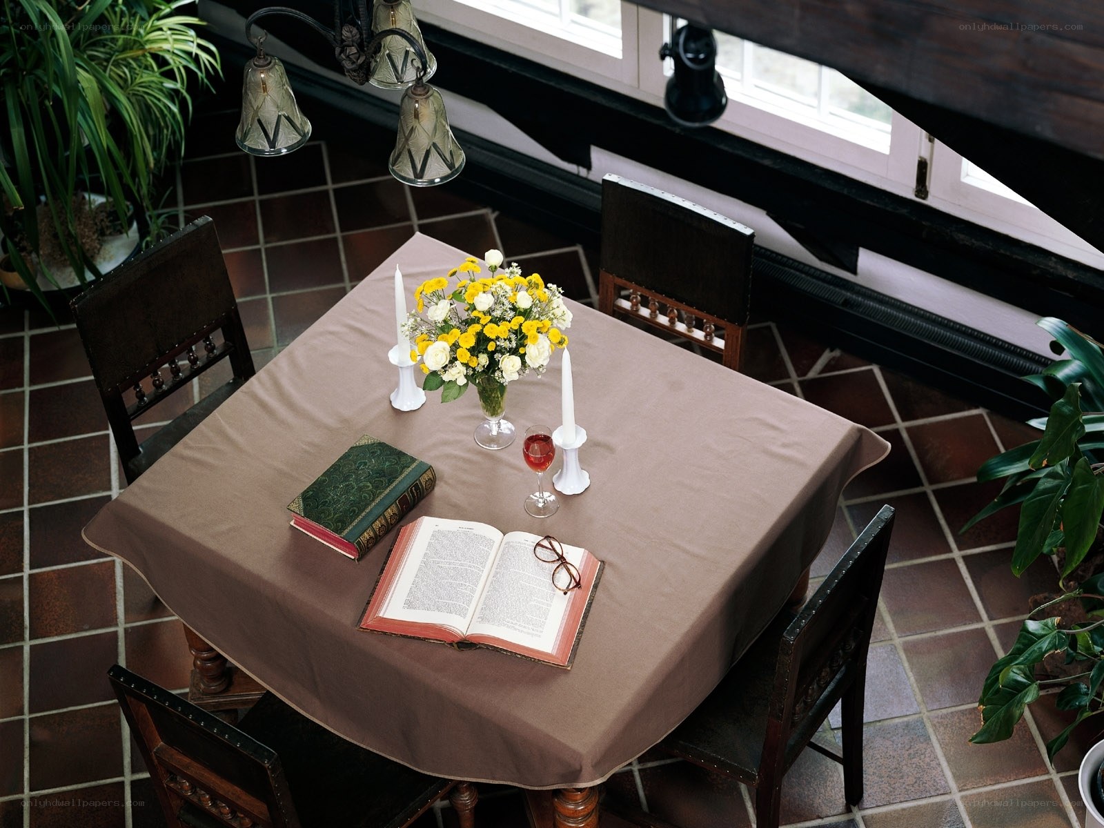 Dining table with flowers and books