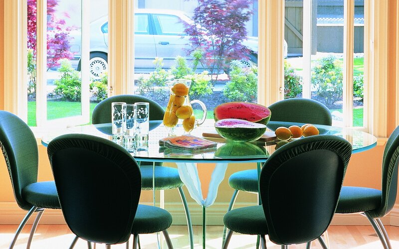 Dining table with fruit and chairs
