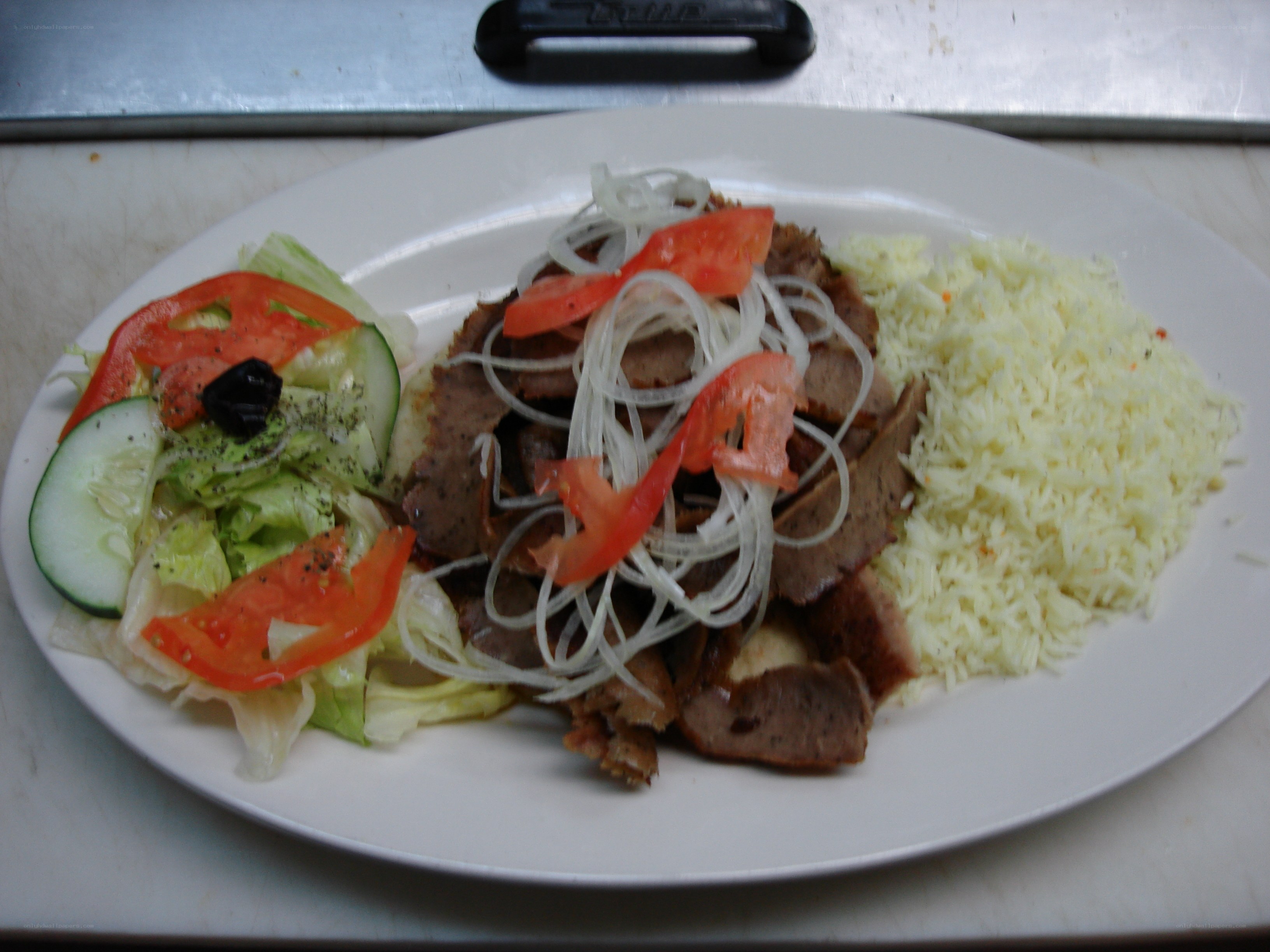 dinner plate with meat and rice
