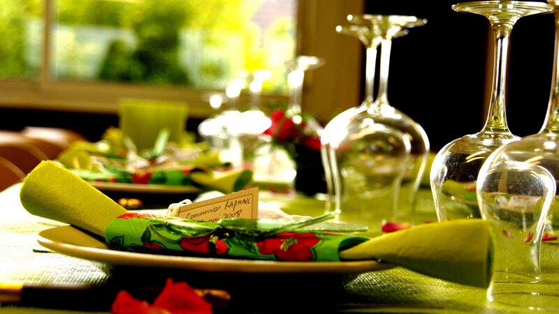 Dinner table setting with green napkins