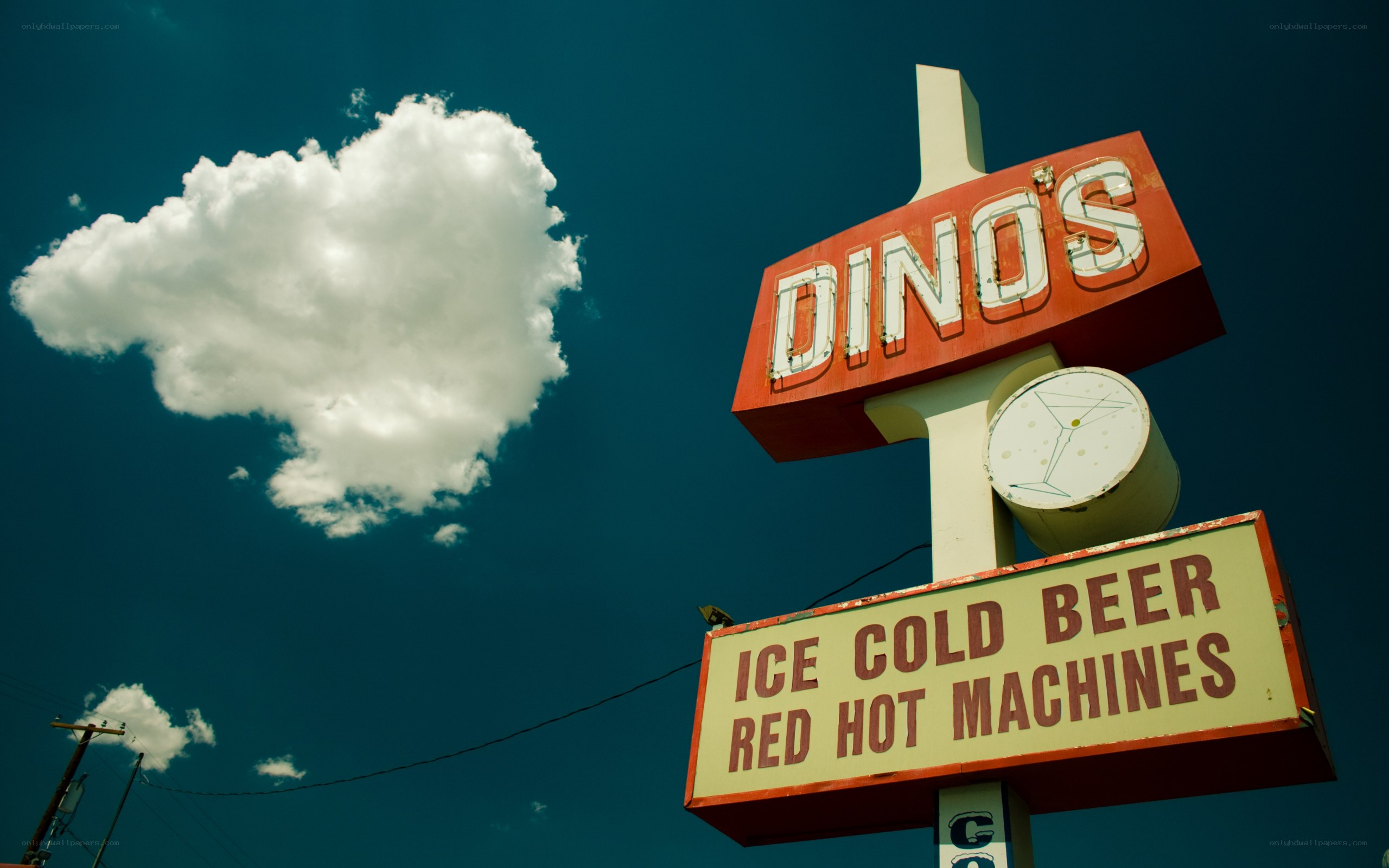 Dino's sign under blue sky