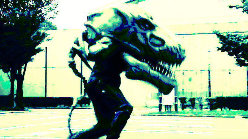 dinosaur costume in parking lot