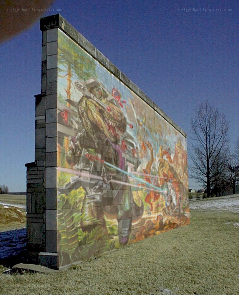 dinosaur mural on concrete wall