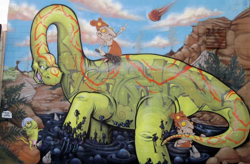 Dinosaur mural with cavemen
