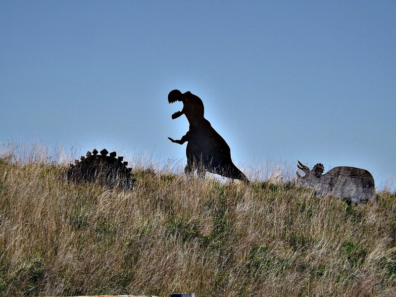 Dinosaur Sculptures on Hill