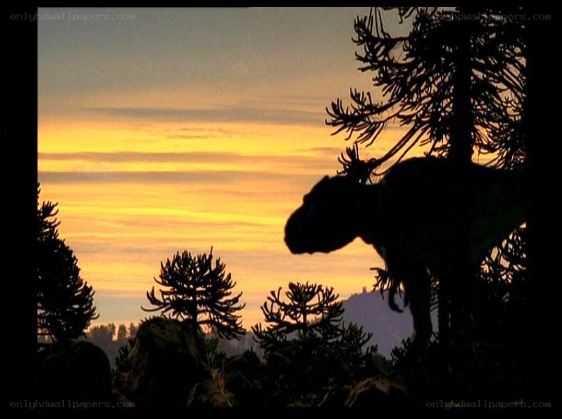 dinosaur silhouette at sunset