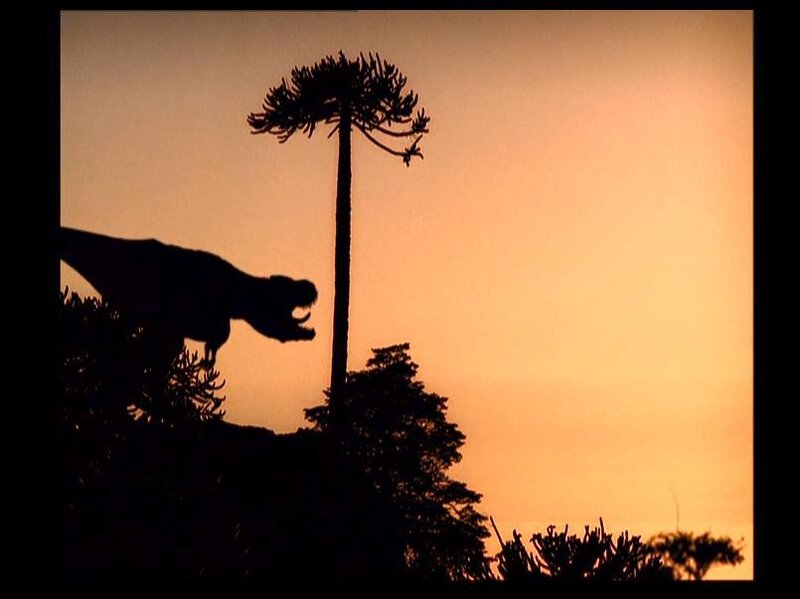 Dinosaur silhouette at sunset
