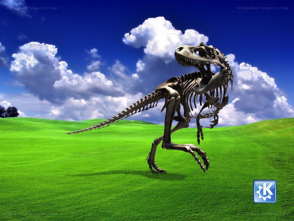Dinosaur skeleton on a green hill