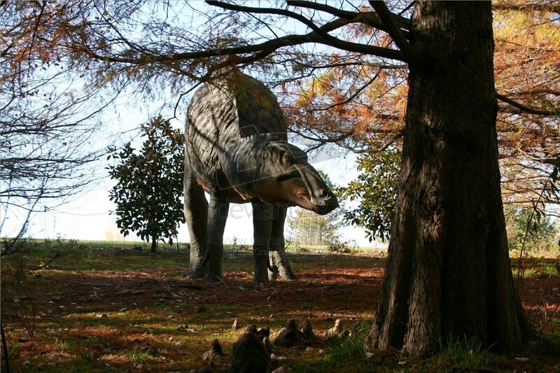 Dinosaur statue in forest