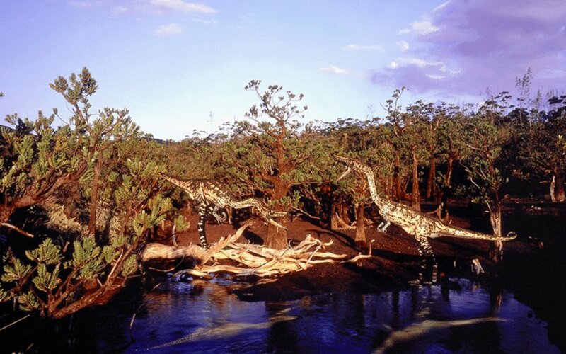 Dinosaurs in a prehistoric swamp