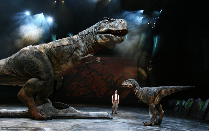 Dinosaurs on stage with actor